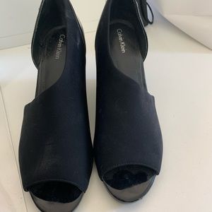 Calvin Klein stretch fabric peep toe wedge.